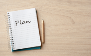 Notebook with Plan written on it